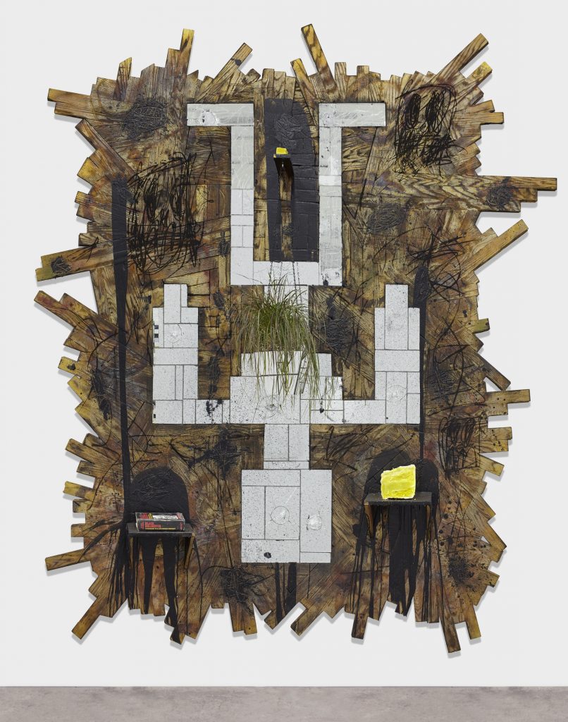 Rashid Johnson 'Falling Man', 2015 Burned red oak flooring, spray enamel, mirror, black soap, wax, shea butter, book, plant. 293.4 x 261.6 x 65.4 cm / 115 1/2 x 103 x 25 3/4 in. © the artist, Courtesy Hauser & Wirth  