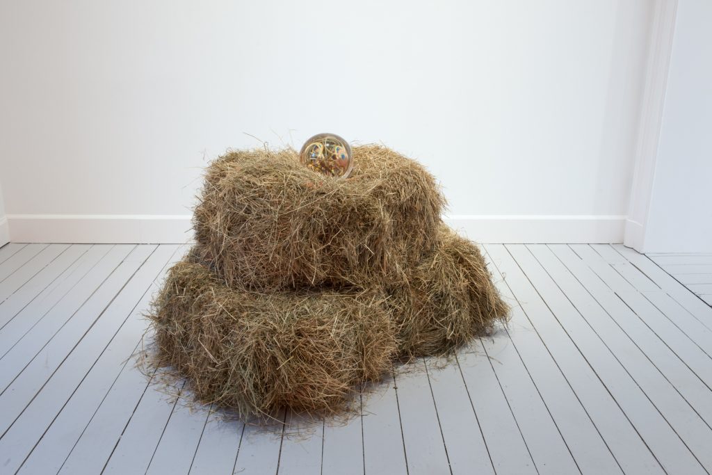 Kasper Bosmans 'Fire Hazard', 2016, detail Hay bales and crystal ball Installation dimensions: 34 5/8 x 47 1/4 x 31 1/2 inches (88 x 120 x 80 cm) Crystal ball: Ø 7 1/2 inches (Ø 19 cm) Hay blocs: 17 3/8 x 23 5/8 x 15 3/4 inches (44 x 60 x 40 cm) each Copyright Kasper Bosmans Courtesy Gladstone Gallery, New York and Brussels Photo: Philippe de Gobert